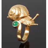 A Jocelyn Burton 18ct gold and emerald ring, modelled as a snail, set with single cabochon emerald,