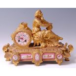 A late 19th century French gilt bronze and pink porcelain inset mantel clock,