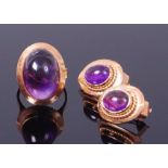 An 18ct gold and cabochon amethyst set dress ring,