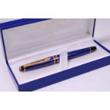 A modern Waterman Expert II lapis lazuli effect fountain pen, with gilt banding,