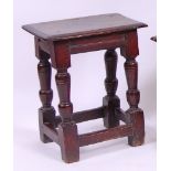 *A circa 1700 oak joint stool, the top having a moulded edge and frieze,