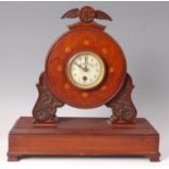 A WW I period mahogany propeller mantel clock,