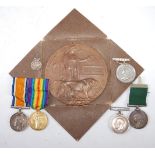 A family group of medals to include WW I bronze memorial plaque,