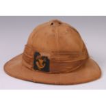 A Foreign Service Wolseley pattern pith helmet of six panel cork construction with Khaki cloth