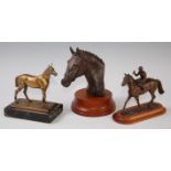 A bronzed resin bust of a racehorse on a socle base,