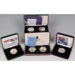 Great Britain, four cased silver coins and coin sets, to include; 2000 Millennium crown 2-coin set,