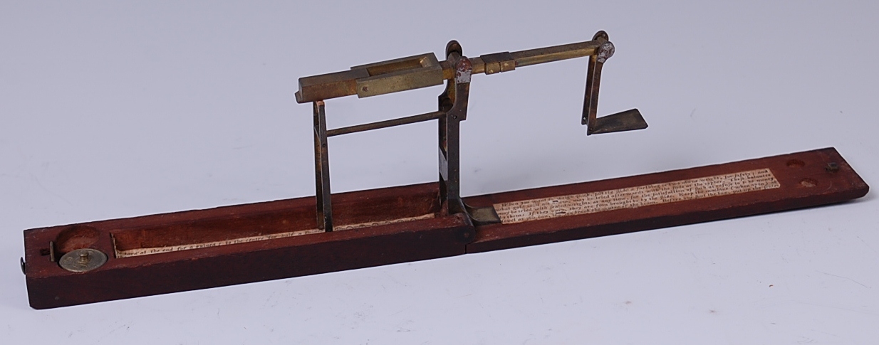 Late 18th century mahogany cased folding guinea scales, bearing label for A.