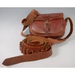 A brown stitched leather cartridge bag, stamped Made in England 50,