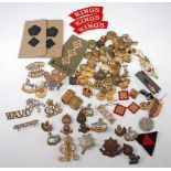 A large collection of cap badges, insignia and buttons to include King's Regiment, Oxford & Bucks L.