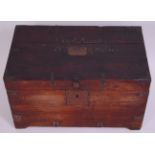 A 19th century teak and iron bound campaign trunk, the hinged lid naming Capt.