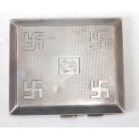 A Geo.V. silver pocket cigarette case having engine turned decoration and Swastika emblems, M.H.