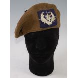 A Scottish Tam O' shanter with badge for the Cameronians,