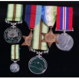 A group of four medals to include WW II 1939-45 Star, Royal Naval Patrol Services,