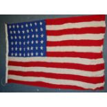 An American star and stripes flag, showing 48 stars, 85 x 143cm.