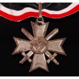 A German Knights Cross of the War Merit Cross with swords, stamped L/58 to the suspension ring,