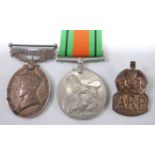 A Geo. VI. Territorial Efficient Service medal, naming 5933695. CFN. C. KENNEDY. R.E.M.E.