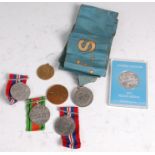 A group of medals to include WW II War x2, Defence, United Nations 1975 silver Peace medal (boxed,