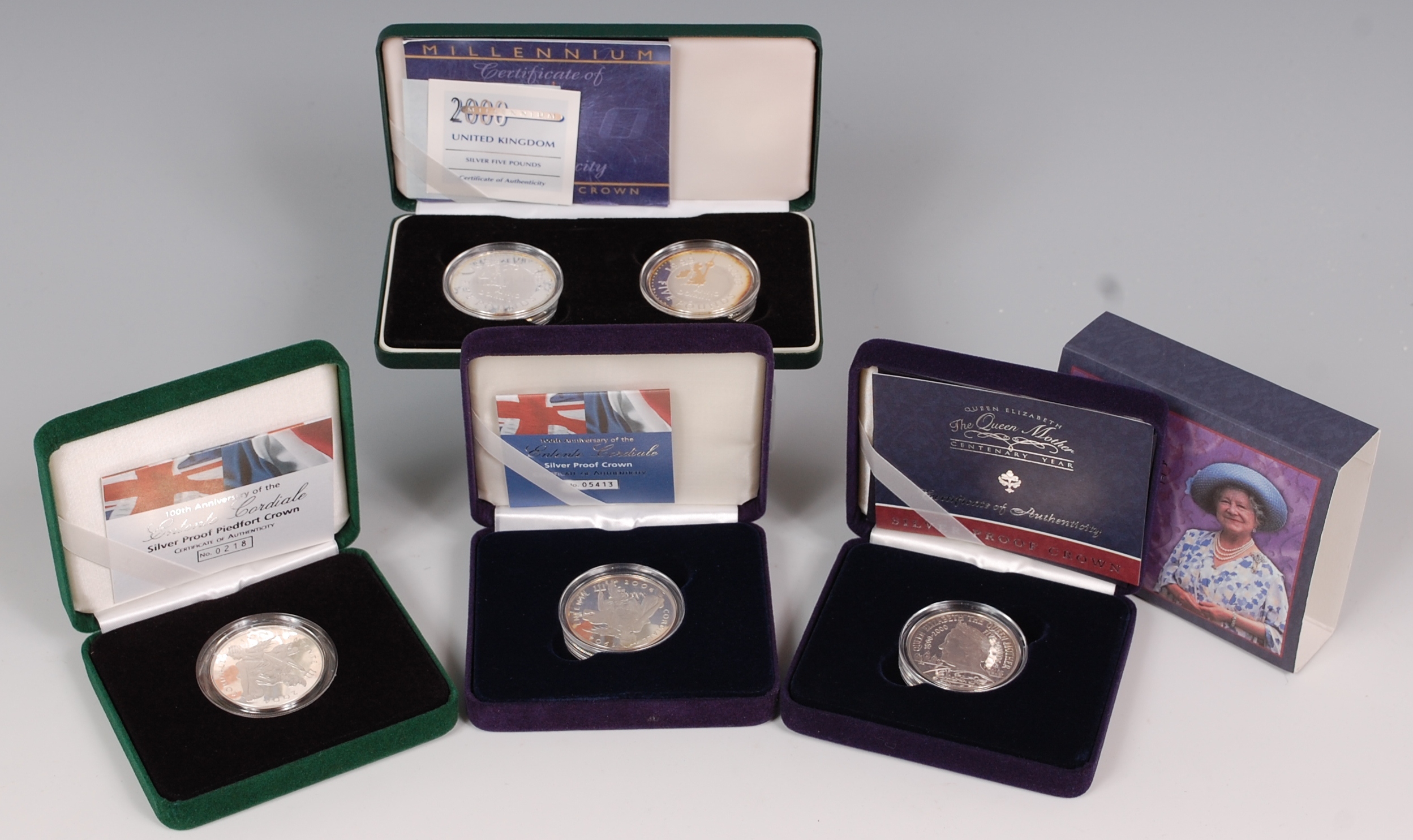 Great Britain, four cased silver proof crowns, to include; 2000 silver five pound 2-coin set,