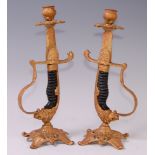 A pair of modern gilt metal table candlesticks, each stem in the form a sword hilt, h.31cm.