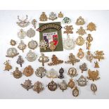 WITHDRAWN A collection of assorted military cap badges and insignia to include Army Cyclist Corps,