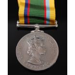 An E.R. II (Del Gratia) Cadet Forces medal, naming ACT. SQN. LDR. H.M. NAYLOR. RAFVR (T).
