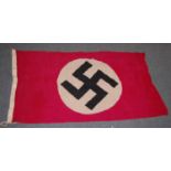 A German N.S.D.A.P. cotton flag printed to the border Berlin N.S.D.A.P. and dated 1943, 73 x 144cm.