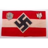 A German Hilter Youth armband, together with a German Youth Hostel Association badge and one other.