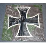 A patch of canvas with printed German Iron Cross emblem, possibly cut from a German plane,