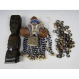 A Maori carved and inlaid wooded Tiki figure together with various other items of ethnic bead-work