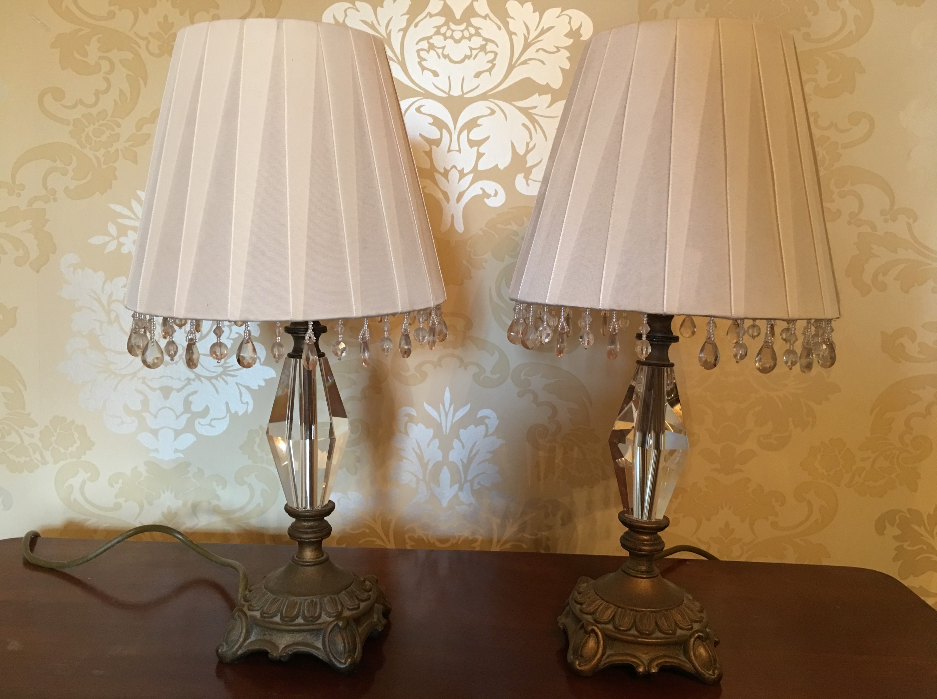 A pair of gilt-mounted cut-glass table lamps