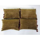 Four feather filled crushed velvet cushions in olive green, with burgundy brocade trim to each end