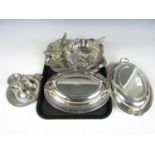 A pair of electroplate tureens together with a chamberstick and a basket etc