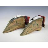 A pair of 19th Century Chinese lotus-bud slippers for bound feet, of crimson silk embroidered with