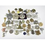 A quantity of original and re-strike cap badges