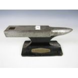 A small anvil with plaque Swan Hunters 1993