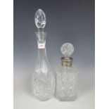 An Indian club decanter together with one other electroplate mounted cut glass decanter