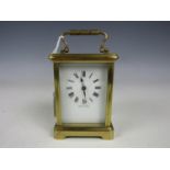 A 20th Century French carriage clock, 11 cm excluding handle