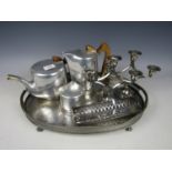 A three piece Picquot ware tea set together with an electroplate galleried tray and a candelabrum