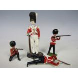 Three Britannia die-cast Grenadier guardsmen together with one other die cast soldier