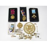 Four Masonic medals, including a silver gilt example, Birmingham, 1980, together with a bullion