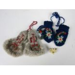 Two pairs of dolls / miniature woollen mittens together with an Edelweiss brooch