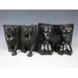 Lion head bookends together with another pair of African bookends