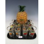 A Britvic pineapple ice bucket together with twelve Britvic Pure Fruit Juice glasses