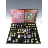 A quantity of British military and reproduction insignia, variously boxed and framed