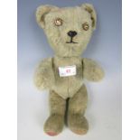 An early 20th century articulated toy bear