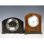 A bakelite mantel clock together with one other