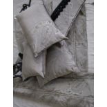 A complete bedroom suite of soft furnishings in a taupe, grey and black paisley pattern,