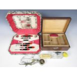 A sewing box, a cased manicure set, an atomizer and a set of scales