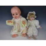 A 1960's moulded doll and one other