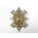 A re-strike cap badge